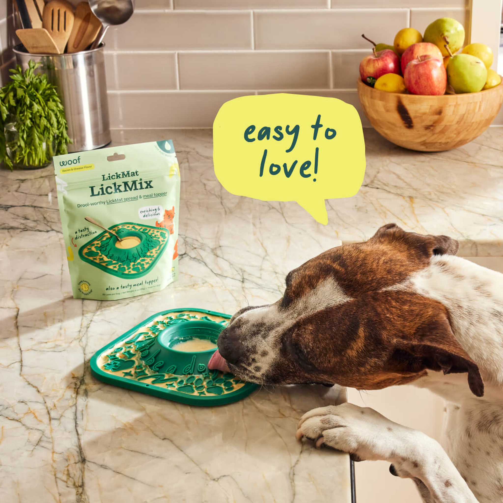 Dog licking Woof Bacon & Cheese LickMix from a lick mat